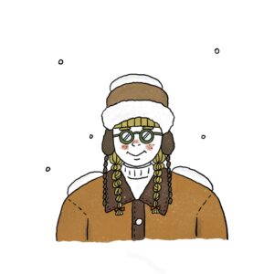 雪が頭と肩に積もった女性